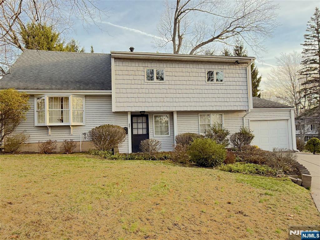 AAA neighborhood. This 4BR split level house was originally the Developerâ€™s model home; approx 1 mile to the K-8 & the highly-rated NVOT high school. The home features a sun drenched living room w/large bay window, beautiful hardwood floors & a formal dining rm w/eat in kitchen overlooking the tranquil backyard & patio. Upstairs features 3 BR & a full bath; further upstairs, the large 4th BR has the potential to be converted into a primary suite w/bath. Downstairs is a family rm w/half bath/laundry rm leading to the garage & sliders to the patio & yard. The large patio & backyard is superb for dining, bird watching, sports & for celebrating milestones w/friends & family. Additional features include low maintenance vinyl siding, Anderson windows & new electrical panel. Welcome Spring in Your New Home!