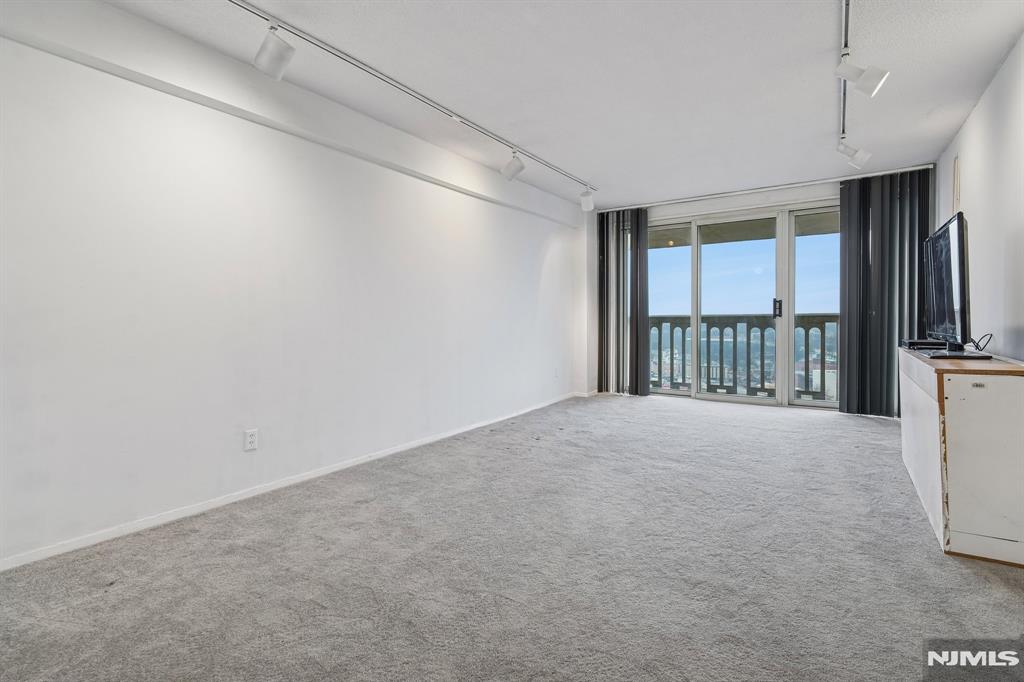 1 bedroom, 1 bathroom on 19th floor with mountain views. The kitchen features warm wood cabinets with an open concept. There is a spacious terrace facing mountain views. Maintenance includes re tax and all utilities. Board approval required. Garage--$60.00 per month, building is wired for Fios and Spectrum. Spectrum bulk cable package--$64.00 per month. OUTDOOR pool, new gym, community room, tennis, pickleball, basketball. NJ Transit 158 at the door. Approximately 819 sq. ft. plus a terrace.