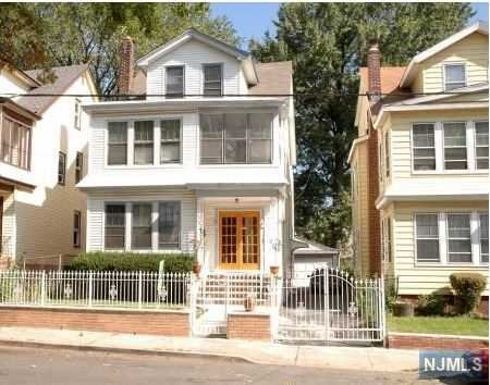 Investor Special! This beautiful colonial style three family features privacy fence, parking spaces and hardwood floors. Close to places of worship, shopping and easy access to highway and public transportation. Lots of potential. This deal is hot and won't last. Call for viewing.