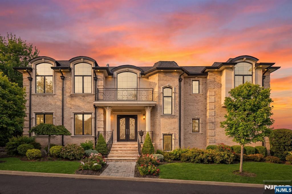 Premier North Cliffs Like-New Constuction just minutes from the GWB. This immaculate, stunning French Chateau-inspired estate offers approx. 6,300 sq ft of luxurious living with a timeless brick and precast exterior. Designed with exceptional craftsmanship, this home features 6 bedrooms and 6 full baths, enhanced by radiant heated floors throughout. The custom chefâ€™s kitchen showcases an oversized island and top-of-the-line Sub-Zero and Wolf appliances, seamlessly flowing into elegant living and dining spaces with exquisite trim work and fireplaces. The expansive primary suite offers a private retreat with its own fireplace, custom walk-in closets, dressing area, and a spa-like Carrara marble bath complete with a freestanding tub and steam shower. All second-floor bedrooms include en-suite baths and walk-in closets. The fully finished basement is ideal for entertaining, featuring a spacious family room, bar, additional bedroom, and full bath. A first-floor bedroom provides the perfect guest suite. Additional highlights include a heated 3-car garage, paver patio, professionally landscaped grounds, and one of the most impressive custom molding packages in Englewood Cliffs. Built by a prominent local builder with every upgrade and custom feature thoughtfully included.