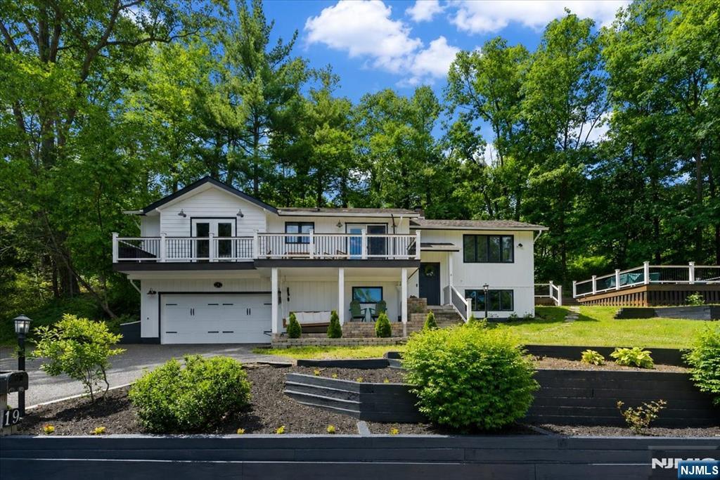 Welcome to premier Greenwood Lake living at its finest in the highly sought after Lakeside Community. Nestled on a quiet street and private lot with lake views from almost every single room in the house. This very new fully renovated home boasts 3 bedrooms (and extra bonus room) 3 FULL baths and a gorgeous open concept layout all throughout. Pride of ownership and craftsmanship in every square inch of this home and property. The most perfect opportunity awaits to experience lake living while avoiding lakefront taxes and still enjoying all of the amenities that come along with the lake such as swimming, boating, paddleboarding and much much more. Close proximity to Warwick, New York where you can enjoy a beautiful downtown or restaurants, shops, wineries, and SO much more. This is one you will not want to miss.
