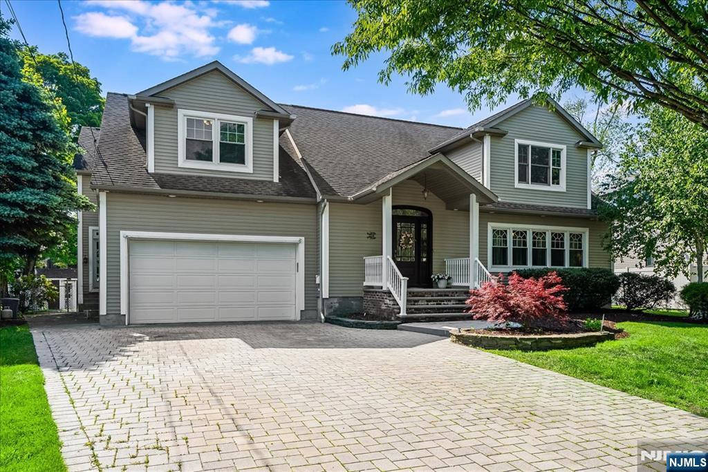Situated on a beautiful property on one of the most desirable streets in Paramus, just minutes from schools, parks, and NYC transportation, this beautifully renovated and well-maintained approx. 3,700 sq. ft. lovely Colonial has everything you have been looking for. A dramatic two-story entrance foyer welcomes you into a spacious first level featuring a large dining room with a butler's pantry, an expansive kitchen with pantry, a comfortable sitting area, powder room and a huge home theater with a small kitchenette. The second floor offers an oversized primary suite with high ceiling, a private bath and large walk-in closet, plus three additional generously sized bedrooms a full bath and ample storage space. The full finished basement includes a laundry room, a sitting area and an office/possible guest bedroom, providing excellent additional living space. Enjoy outdoor entertaining on the beautiful deck overlooking the private property. Conveniently located near the elementary and middle schools, Dunkerhook Park, and NYC transportation, this exceptional home combines space, comfort, and a prime location. The media room can be converted into a first floor bedroom.