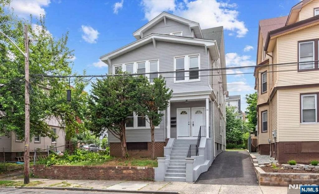 A rare find ! This income-generating three-family home offers an exceptional opportunity for investors or owner-occupants, boasting an impressive total of 11 bedrooms and 3 bathrooms across three expansive, freshly updated units. The incredibly spacious layouts include unit 1 with 4 bedrooms, unit 2 offering 5 bedrooms, and unit 3 with 2 bedrooms each featuring 1 full bathroom, modern neutral paint tones, recessed LED lighting, and low-maintenance wood-look laminate flooring throughout. The bright, updated kitchens showcase oak cabinetry, sleek granite countertops, and clean white tiling, while the fully renovated bathrooms stand out with modern gray vanities, contemporary hardware, and floor-to-ceiling custom tile tub surrounds. The bright, updated kitchens showcase oak cabinetry, sleek granite countertops, and clean white tiling, while the fully renovated bathrooms stand out with modern gray vanities, contemporary hardware, and floor-to-ceiling custom tile tub surrounds. On the exterior, the property shines with updated grey vinyl siding, a prominent front gable, and large bay windows that flood the massive floor plans with natural light. Tenants will love the rare convenience of a private, paved side driveway for off-street parking, secure concrete steps with wrought iron railings, and a small backyard space perfect for low-maintenance outdoor storage or relaxation. Hurry, book your showing today!