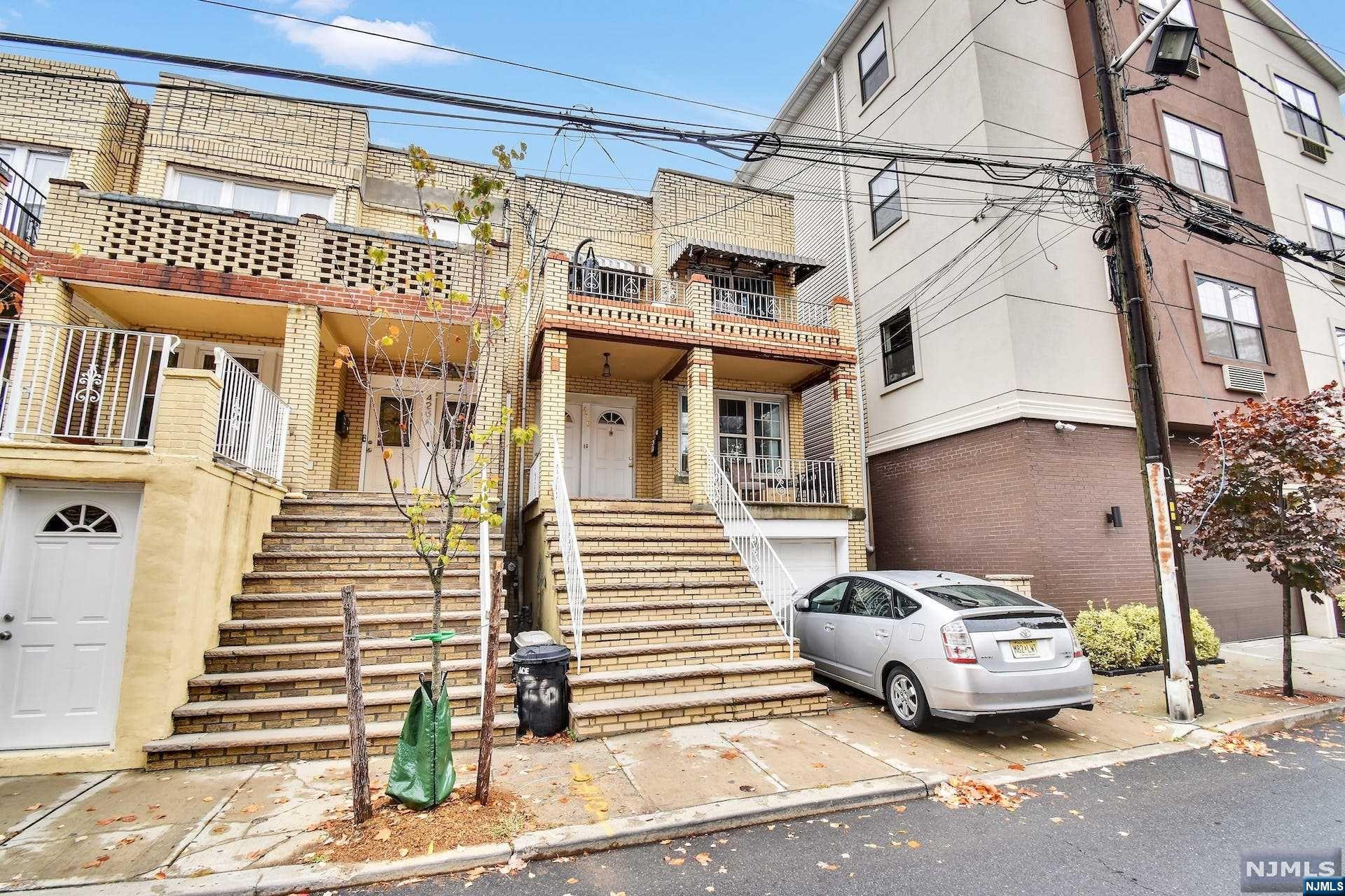 Back on Market. Welcome to this all brick two family home less than a block away from shopping and mass transportation. First unit offers two floors with 2 bedrooms, eat-in kitchen, 2 full baths, wet bar, access to rear yard, and attached garage. Second unit offers 3 bedrooms, balcony, and eat-in kitchen. Property sold "AS IS."