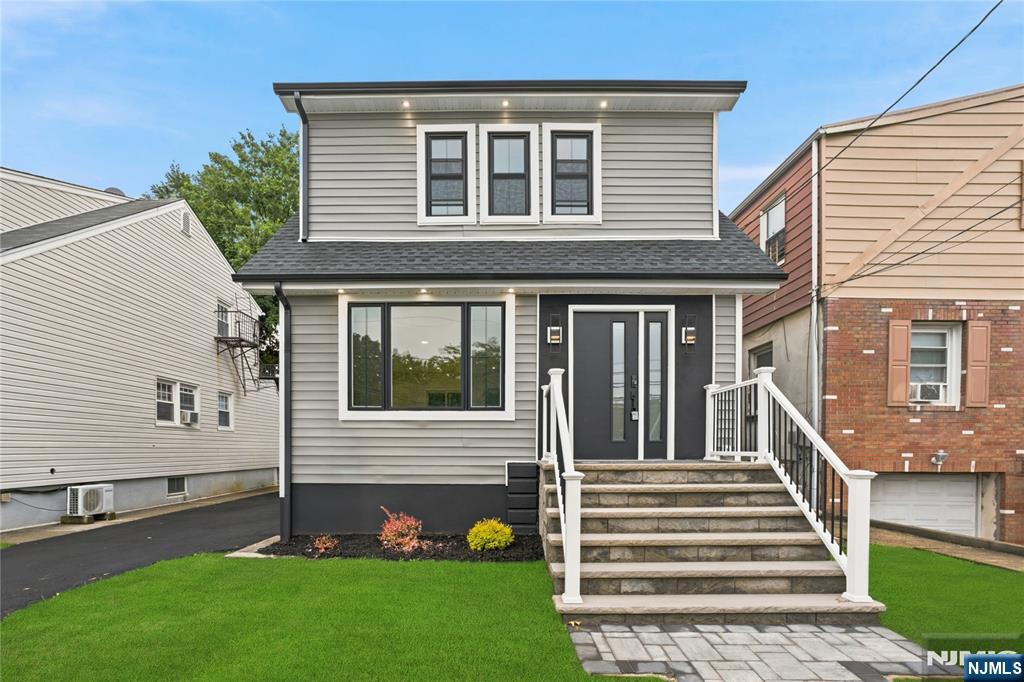 Welcome to 444 Joralemon Street, a beautifully reimagined Cape that blends timeless character with modern updates in one of Belleville's most convenient locations. Set on a 3,750-square-foot lot, this move-in ready home offers 8 well-appointed rooms, 3 spacious bedrooms, 1 full bath, and 1 half bath designed for comfortable everyday living. The bright, open-concept main level features rich red oak hardwood floors, a stunning new kitchen with updated appliances, stylish finishes, and a seamless connection to the dining and living areas. Sliding glass doors open to a private backyard with a spacious deck, creating the perfect setting for outdoor dining, entertaining, or relaxing. Upstairs, three generously sized bedrooms offer ample closet space, new flooring, and updated windows that fill each room with natural light. The finished basement provides flexible space ideal for a recreation room, home office, gym, or media area. Additional highlights include central air conditioning, a detached garage, new roof shingles, new vinyl siding, new pavement, updated windows, and numerous quality improvements throughout. Ideally located near Branch Brook Park, local shopping, restaurants, schools, houses of worship, major highways including Routes 21, 3, and the Garden State Parkway, as well as NJ Transit and convenient access to Newark and New York City, this home offers the perfect balance of style, comfort, and accessibility.