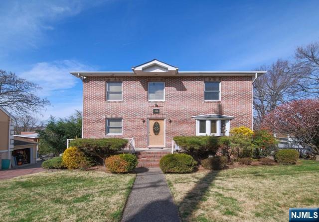 Brick-faced cape cod style home in the much sought after town of Leonia. Although situated on Grand Ave, the home is located deeper into the lot with copious amount of tree in the front yard providing complete privacy from Grand Ave. The lot of the home also features the regular driveway from Grand Ave and the back entrance from Ames Ave that serves as your own private secondary driveway as well. The home itself is warm and inviting with ample sized rooms all throughout. Having three full bathrooms and both rooms upstairs having its own bathroom is also a huge plus for convenience purposes. The deck connected from the kitchen is a phenomenal addition to the house serving as extra space for all forms of gatherings or a private space for some peace. Ground floor is full and finished which also allows separate entrance to the driveway and garage. In addition, there is a public park behind the lot which is perfect for leisurely strolls or even parking for guests. Come see for yourself