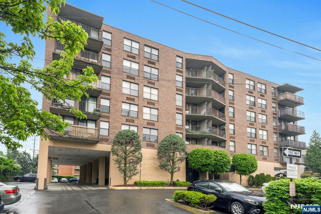 Experience the best of urban convenience and suburban tranquility in this top-floor 2-bedroom, 2-bathroom condo at Columbia House, located close to NYC transportation, shopping and schools. This south west corner unit located in an elevator building features a southern-facing terrace that offers seasonal views of the New York City skyline, providing a perfect backdrop for relaxation. This unit has been professionally cleaned with newer carpet and fresh paint. Columbia House is a well-maintained, mid-rise building offering amenities such as laundry in the unit, security cameras, and deeded covered parking. The building's low maintenance fees cover common area upkeep and water. Plan to visit this secluded area of town with limited traffic passing by. Situated between Palisade Ave and Anderson Ave. Great opportunity to own this spacious, comfortable and convenient condo home!