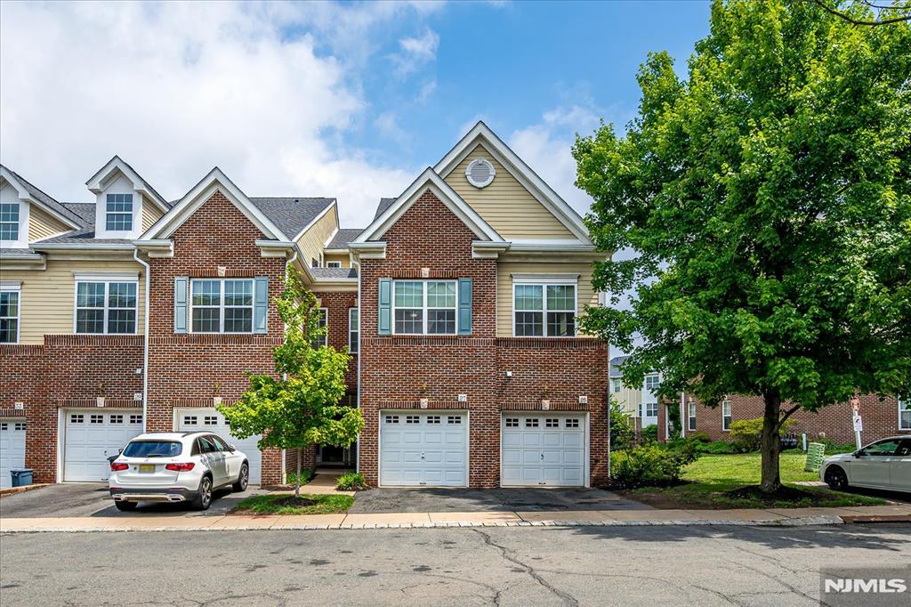 Welcome to this well-maintained 2-bedroom, 2.5-bath townhome located in the heart of historic Morristown, offering comfort, convenience, and an exceptional location.The main level features an open-concept layout with spacious living and dining areas, beautiful hardwood floors, and a kitchen that flows seamlessly into the main living space. A powder room and an attached one-car garage add everyday convenience.The second level includes a spacious primary bedroom with a large closet, an en-suite full bathroom, and sliding glass doors leading to a private balcony. A second bedroom, an additional full bathroom, and a conveniently located laundry and utility room complete the upper level.Conveniently located just around the corner from the Morristown NJ Transit Station with Midtown Direct service to New York City, the home also offers easy access to Routes 287, 24, 80, and 280. Approximately one-half mile from downtown Morristown, you'll enjoy close proximity to restaurants, shopping, parks, cultural attractions, and everyday conveniences.This townhome offers low-maintenance living in one of New Jersey's most sought-after communities, combining a functional floor plan with an outstanding location.
