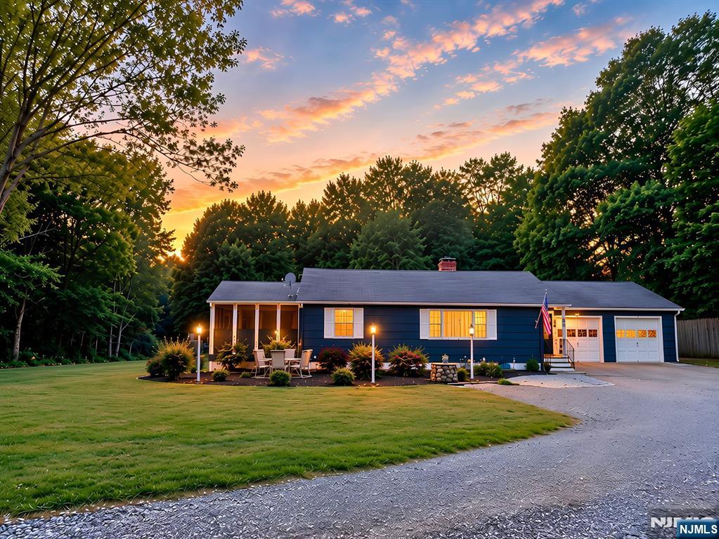 Welcome to this spacious ranch on a beautiful level & .71 acre lot in desirable lower West Milford. Just minutes from Route 23, Bloomingdale, and Norvin Green State Forest with miles of scenic hiking trails, this home offers the perfect blend of privacy and convenience. Features include hardwood floors (also beneath the carpeting), a wood-burning fireplace, generously sized rooms, and a primary bedroom with a private screened porch overlooking the peaceful backyard. The partially finished basement offers a large family room, bonus bedroom, second kitchen, and abundant storage. One bay of the attached two-car garage is currently used as an exercise room and can easily be converted back. A whole-house natural gas generator provides reliable backup power for added peace of mind. Close to shopping, dining, parks, and major commuting routes.