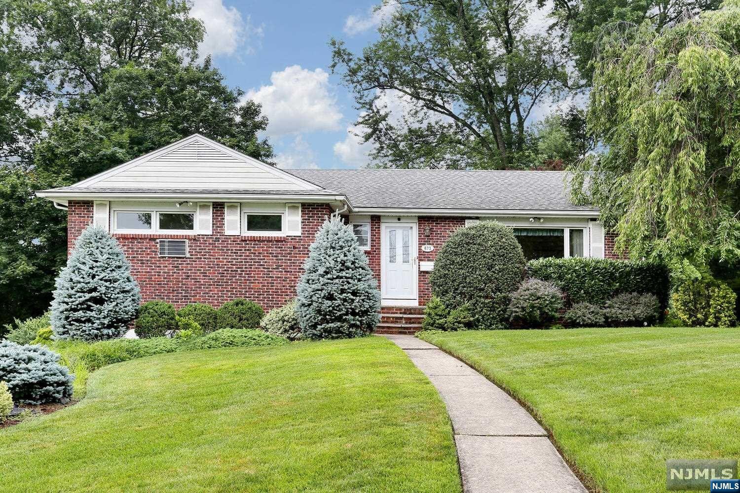 Welcome to this charming brick ranch in the desirable town of Oradell. One floor living at it's best, this 3 bedroom ranch has been impeccably maintained. An entry foyer w/guest closet leads to a living room with wood-burning fireplace, Dining room with corner cabinets, MEIK, and a den/family room which leads to a deck overlooking the spacious backyard. The primary bedroom has it's own updated bath, 2 good size bedrooms and another updated bath. The large finished basement is perfect for entertaining, with an additional family room, workout area, home office, the possibilities are endless. The gorgeous expansive property (90 x 163) with it's lush professionally landscaped property offers tranquility and privacy, a true backyard oasis. Located on a quiet cul-de-sac yet conveniently located near Oradell's top rated schools, shopping, restaurants and easy access to NYC transportation via train or bus. You will love living here!