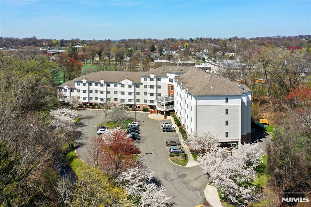 Welcome to Sipporta Village, a highly desirable "65+ community" in the heart of Paramus. The home offers desirable southern exposure and has been thoughtfully updated: newer appliances, brand new luxury vinyl plank (and carpet) flooring, and recent improvements, including updated faucets, fresh paint, and new light switches and outlets. This well-maintained 1bed/1bath residence also features a versatile den ideal for a home office or accommodating overnight guests. Convenient in unit laundry area. Monthly maintenance includes everything: heat, gas, hot water, taxes, cable, parking, storage, community room. The building is maintained full-time and offers a weekday shuttle to local grocery stores, malls, and other amenities. Ideally located directly across from Van Saun Park and close to everything Paramus has to offer, this home presents a wonderful opportunity to enjoy comfort and privacy, and also convenience and community in one of the areaâ€™s most desirable buildings. Sipporta Village does not allow mortgages - cash only purchases.
