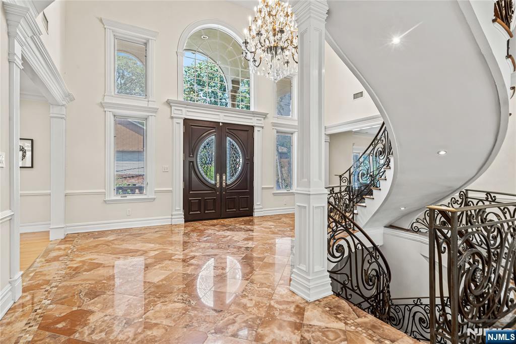 Welcome to your own private retreat just minutes from New York City. This exceptional Colonial estate offers a rare combination of luxury, privacy, and impeccable care. This oversized lot spans 85' x 100' (8,599sf), making it the largest plot on the street. Tucked away behind a beautifully landscaped, zen-inspired garden, the property features a full-size in-ground pool surrounded by lush greenery, creating a true backyard sanctuary with unmatched seclusion. Meticulously maintained by its original owners and never leased, this residence has been thoughtfully cared for as a part-time home and remains in pristine condition throughout. Every detail reflects quality craftsmanship and timeless elegance. Designed for both everyday living and effortless entertaining, the chefâ€™s kitchen is fully equipped with premium appliances and generous space to prepare anything from intimate dinners to large gatherings. A grand spiral staircase makes a striking impression and leads to the second level, where youâ€™ll find spacious bedrooms filled with natural light. The expansive primary suite serves as a luxurious private escape, complete with an oversized en-suite bath and exceptional proportions. This is more than a home, itâ€™s a lifestyle experience best appreciated in person. Schedule your private showing and discover the comfort, elegance, and tranquility this remarkable property has to offer. Video walkthrough also available, upon request.