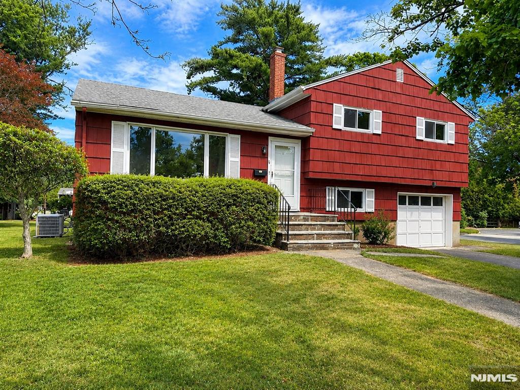 Welcome to this beautifully renovated split-level home, situated in a highly desirable Closter neighborhood. Extensively updated in 2022, this residence features modern finishes and pristine hardwood flooring throughout. The main level offers a spacious living room and a formal dining area ideal for entertaining, complemented by a fully renovated kitchen boasting custom cabinetry and premium appliances. The second floor hosts generously sized bedrooms and a sleek, updated full bathroom. The ground level provides versatile living space, including a comfortable family room and a second modern full bathroom. Notable features include central air conditioning, a spacious backyard, and a prime location proximate to downtown shopping, houses of worship, public transportation, and the acclaimed Closter school system. Experience contemporary comfort in a premier setting; pets are welcome subject to conditions.