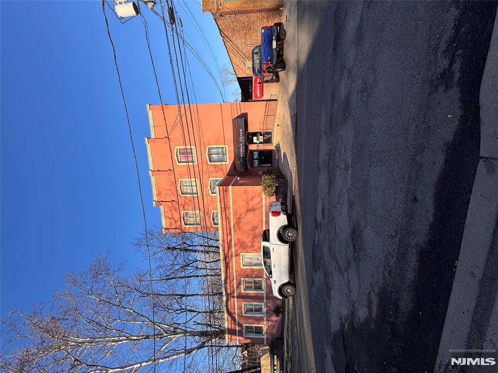 Exceptional mixed-use investment and redevelopment opportunity in the vibrant downtown district of Plainfield. Located at 12-18 Washington Ave, Plainfield NJ 07060 (Lots 9,16,17 & 18) This Property sits in a prime urban-suburban mixed-use corridor with strong visibility and convenient access to local amenities and transportation. The Property currently features multiple income-generating components, Including an operating daycare, a warehouse space with a loading dock, a juice bar and two residential apartments. The residential units consist of one spacious 2-bedroom, 2 bath apartment and one 1-bedroom, 1 bath apartment, offering additional rental income potential. A dedicated parking lot entrance from Washington Ave provides approximately six off-street parking spaces, adding valuable convenience for tenants and visitors. With its large combined lot and prime downtown location, this property presents an outstanding opportunity for investors, developers, or owner-users. The site is well suited for future redevelopment into a modern mixed-use residential and commercial building, capitalizing on the continued growth and revitalization of the Plainfield downtown area. A rare chance to acquire a versatile property with existing income streams and significant long term development potential.