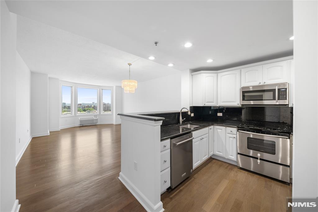 Call Eric Kim (2 0 1 - 4 2 1 - 5 9 4 9) | Welcome to your Urban chic living at its best - 6408 City Place is what youâ€™ve been waiting for! Step into a spacious, light-filled layout and immediately gaze out at stunning Hudson River and NYC skyline views - the kind that never gets old. Thoughtfully renovated with care and intention, this 2-bedroom, 2-bath home features warm, newly stained wood floors and a beautifully updated kitchen with a brand-new refrigerator, sleek cabinetry, modern recessed lighting, and a clean, contemporary feel. Both bathrooms have been refreshed with stylish finishes and sleek, modern light fixtures, completing the homeâ€™s polished, move-in-ready appeal. Designed as a true urban oasis, this residence also offers the convenience of an in-unit washer/dryer and a covered garage parking space right below. Just downstairs, enjoy a vibrant lifestyle with shops, dining, and everyday essentials at your fingertips - and for commuters or a night out, NYC is just a quick bus hop away. Effortless, elevated, and undeniably chic - this is city living done right. Call Eric (201-421-5949) to set up a showing today!