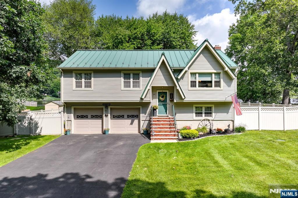 Welcome to your dream lakefront retreat on Seneca Lake! This fully updated 3 BR, 2.5 Bath haven offers the ultimate resort style lifestyle and it comes fully outfitted with all outdoor furniture and boat included! Step inside to find an inviting open layout anchored by a cozy wood-burning fireplace in the lower level family room. A dedicated home office that is bright, comfortable, and private workspace perfectly suited for remote living. The remodeled kitchen and bathrooms boast modern finishes, while the primary suite serves as a private sanctuary complete with a full bath and double closets. Outside, host unforgettable gatherings on the spacious entertaining deck overlooking breathtaking, unobstructed lake views and a peaceful koi pond. Step down to your private boat dock for a day of fishing, swimming or cruising. Located in a vibrant lake community with a beach, playground, clubhouse, and Andre's lakefront dining just a short stroll away. Plus, enjoy close proximity to Sparta, Lake Mohawk, and Tomahawk Lake. With a whole-house generator included, peace of mind is built right in. 1 Year Home Warranty included! Just pack your bags your lakefront lifestyle starts here!