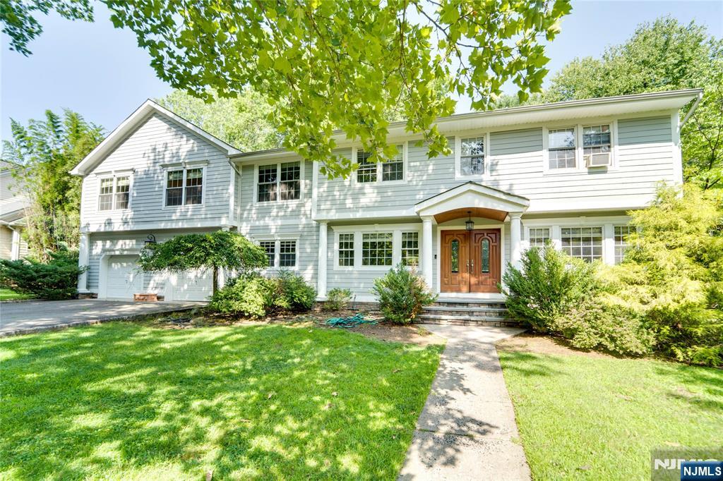 Welcome to this beautifully maintained Colonial nestled on a lush .57-acre property in the heart of desirable Old Tappan. Offering approximately 2,900 sq. ft. of living space, this spacious residence features 5 bedrooms and 3.5 baths with an ideal layout for both everyday living and entertaining. Sun-filled interiors showcase gleaming hardwood floors throughout, while generously sized rooms and timeless charm create a warm and inviting atmosphere. The main living areas flow seamlessly to the private backyard, offering endless possibilities for outdoor enjoyment, recreation, or future customization. A 2-car garage, expansive property, and prime location near highly acclaimed Blue Ribbon schools, parks, shopping, and dining complete this exceptional offering. Rare opportunity to own a distinguished home in one of Bergen County's most sought-after communities.