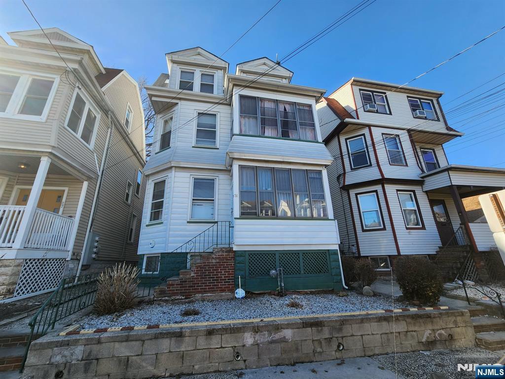 Welcome to this charming 3 family home in a great location. The first floor apartment features a 2 bedroom with Living room, Dinning room, large Eat in Kitchen, and an office that can be a potential 3rd room. Entering the 2nd floor, there is an additional 2 bedroom apartment with a similar layout as the 1st floor. It also features an additional office in the rear or 3rd room and an additional sunporch in the front of this unit with the potential to be a 4th room. The 3rd floor has a 2 Bedroom apartment with a LR/Eat in Kitchen Combo. In the basement there is Full Bath, finished family room and kitchenette. Additionally there is the meter room, storage rooms and coin operated laundry that will be included with the sale of the home. The home is conveniently located close to public transportation with bus stops on Ridge Rd and sits in a great location for transportation to NYC with Train Stations in Lyndhurst and Harrison Path. Security system in place with 4 cameras indoor/outdoor. Owner Occupied.