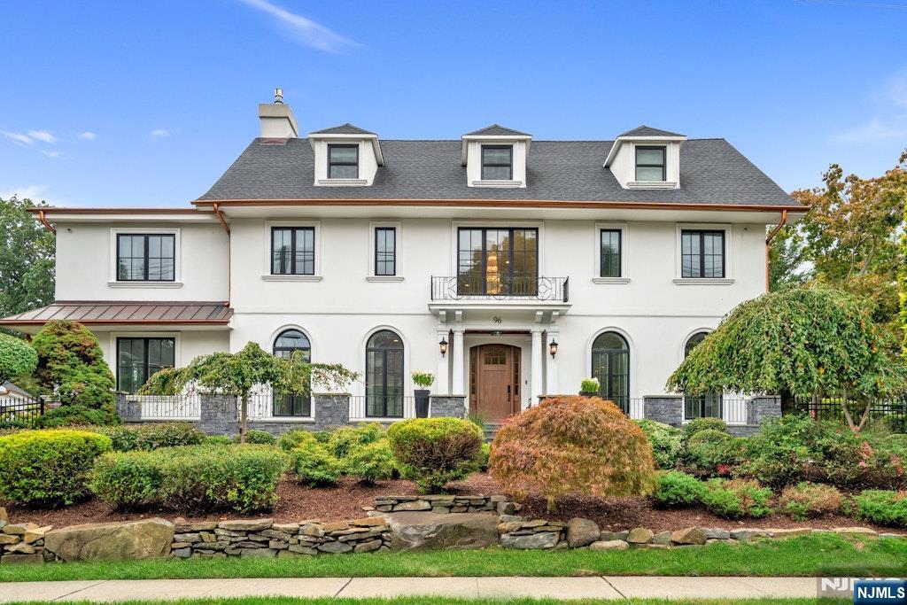 Set on a rare double lot, this stunning 6-bedroom residence offers over 5,200 square feet of uncompromising quality in Fort Lee's desirable Bluff neighborhood. Designed for both elegant living and effortless entertaining, the home seamlessly blends timeless style with modern functionality. The first floor presents a chefâ€™s kitchen with custom cabinetry and top-tier appliances, a dining room, sunroom, two living areas, a mudroom, and a powder room. Enjoy radiant heating on the first and second floors for year-round comfort. The second floor boasts a luxurious primary suite with a sitting area, fireplace, wet bar, terrace, dual walk-in closets, and a spa-like bath. Also on this level are an ensuite bedroom, two additional bedrooms with a shared bath, and a convenient laundry room. The third level includes two bedrooms, a full bath, and bonus space, while the finished lower level offers a wet bar, wine cellar, powder room, and a second laundry. Outdoors, a fenced yard with a paver patio, firepit, and sprinkler system awaits. A heated three-car garage with EV charging and gym completes this remarkable property, offering state-of-the-art systems. An exceptional opportunity for long-term value, with the potential to re-subdivide the lots and unlock additional investment possibilities.
