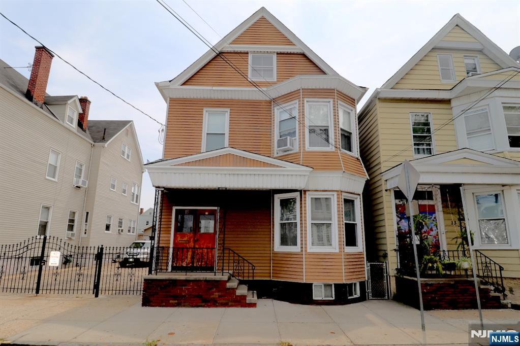 Welcome to 15 Darcy St! This fantastic, well-maintained two-family home is located in Newark's highly desirable Ironbound neighborhood, offering the perfect combination of owner-occupancy and investment potential. Ideally situated a short walk from Newark Penn Station, you'll enjoy an easy commute to New York City with a 20-minute train ride into Manhattan. The property is also just minutes from the vibrant heart of the Ironbound, renowned for its outstanding restaurants, shopping, and neighborhood charm, including the popular Wilson Avenue dining district. The first-floor unit features a spacious kitchen, living/dining room, and a full bathroom. The second-floor unit offers a kitchen, living room, two bedrooms, and a full bathroom. Additional highlights include hardwood flooring throughout, a partially finished attic providing flexible bonus space, an unfinished basement with ample storage, separate utilities, and a large backyard perfect for outdoor enjoyment. Don't miss this exceptional opportunity to own a versatile two-family home in one of Newark's most vibrant and convenient neighborhoods!