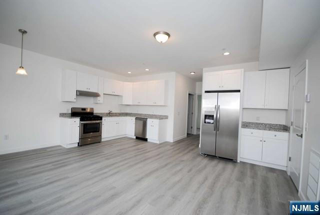 Bright and spacious 2-bedroom, 2-bath apartment located in a highly convenient area of southern Bergen County. This well-maintained apt features an open-concept living room and kitchen layout, perfect for everyday living. Enjoy the added convenience of a separate in-unit laundry room with washer and dryer included, along with two assigned parking spaces and pull-down attic storage. The primary bedroom offers a private small balconyâ€”ideal for morning coffee or relaxing in the evening. Excellent location close to public transportation, parks, restaurants, and all local amenities, making commuting and daily errands a breeze.