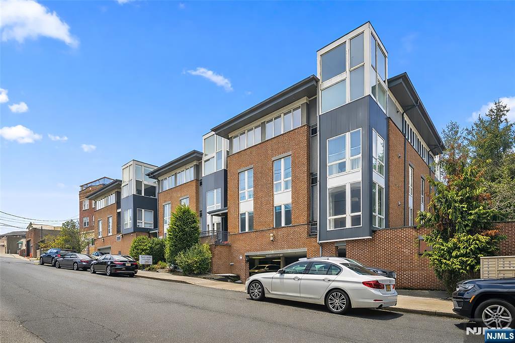 I am excited to share a new listing for a truly exceptional corner unit in highly desirable Cliffside Park. Built in 2009, this rarely available two-bedroom, two-bathroom condo offers 1,264 sq. ft. of thoughtfully designed living space. As an east-facing corner unit, the home is bathed in natural light from oversized, floor-to-ceiling windows. Key features of this residence include: - Chefâ€™s Kitchen: Sleek granite countertops, stainless steel appliances, and a convenient overhang island. - Open Layout: A wide foyer leads into spacious dining and living areas, perfect for entertaining. - Primary Suite: A peaceful retreat featuring two closets (including a walk-in) and an ensuite bathroom with a soaking tub. - Split Floor Plan: The second bedroom is located on the opposite side of the unit for added privacy. - Modern Amenities: In-unit washer/dryer, hardwood floors throughout, central A/C, and two garage parking spaces. The location offers effortless commuting with express bus service to NYC just steps away. With local schools, shopping, and dining nearby, this home provides a rare combination of sophistication and comfort.