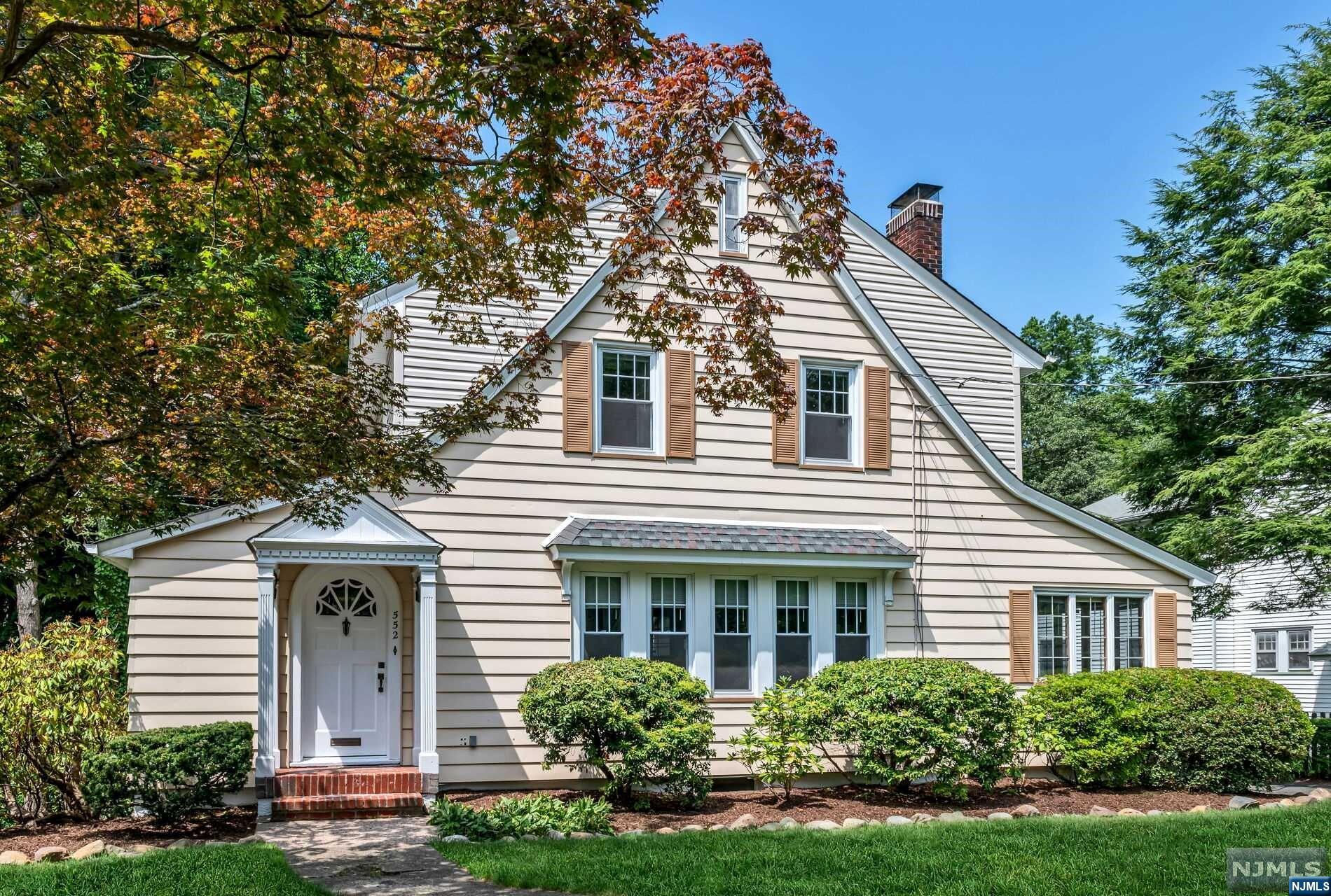 Lovely side entry colonial with modern updates and beautiful period touches. Foyer to FLR: Prepare to be wowed by the wood floors and millwork, the bank of windows, and WB/FPLC flanked by glass doors leading to the vaulted sunroom. FDR is a great size with views of the yard, leaded glass accent window. The cheerful freshly painted MEIK w/updated light fixtures, stainless appliances and bonus rear mudroom entry/pantry area. Gorgeous staircase w/two sides to the bottom landing (LR & KIT) and the charm continues upstairs w/three pretty bedrooms and hall bath with attractive tile work and brand new vanity. The large basement boasts newly carpeted stairs to a fun play/fam rm, multiple storage agreas, large laundry rm, Bilco doors to the wrap around patio outside. 2C GAR w/opener, don't miss the BONUS rm below, accessible from the lower yard. Central air, nice landscaping, Willard School, easy access to downtown Village and Ho-Ho-Kus.