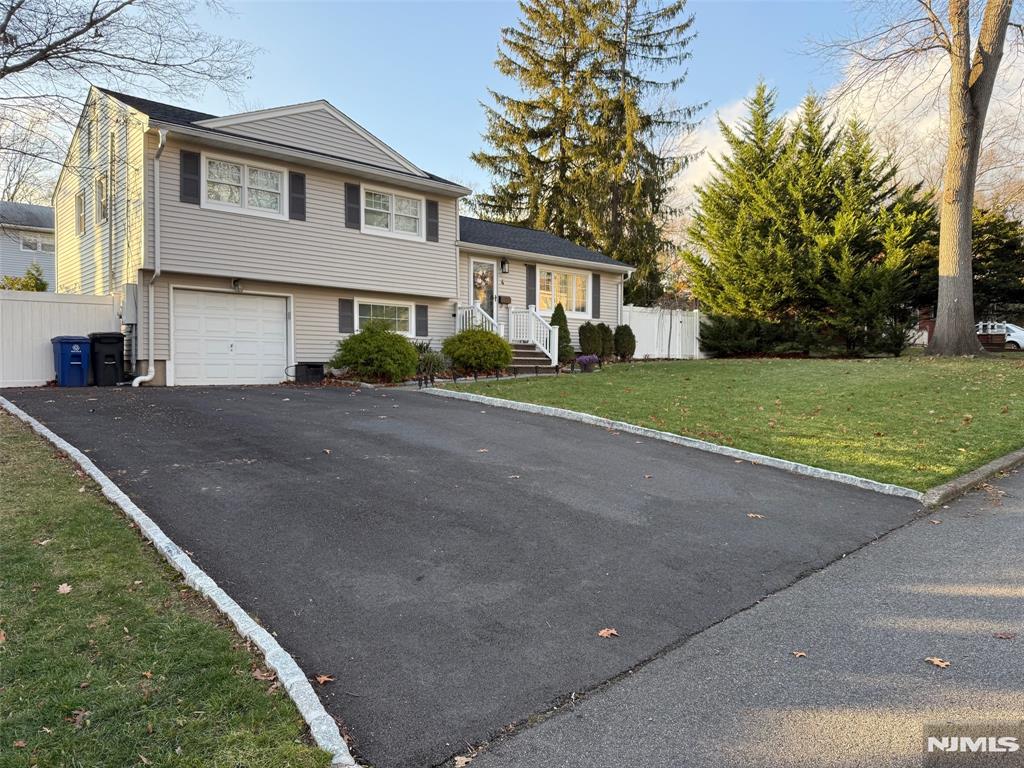 Prime sought after Montvale location in wonderful quite neighborhood... Welcome to this lovely maintained 3 bedroom 2 1/2 bath split level. Ground floor features family room, full bath (new 2025), garage and 3 season room (12/2021). First floor features entry foyer, living room, dining room with newer Anderson doors to spacious Trex deck (5/2020), and modern kitchen. Second floor features primary bedroom with half bath, two additional good-sized bedrooms, and full bath. Partial basement partially finished, with playroom/entertainment/TV room, storage, and utilities. Special feature: Hardwood floors, central air condenser and air handler replaced, newer roof, newer four car driveway, crown molding, Anderson window, new appliances, new furnace, lawn sprinklers, house painted, Trex railing on front steps, fenced in backyard and a whole house generator. Close to schools, restaurants, parks, major highways and EZ commute to NYC by both train and bus.