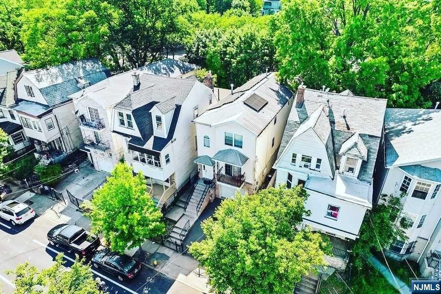 Another massive-money-making Multifamily available to enjoy this summer right in front of the Park! With Over 2,500 SQFT of living space, each floor gets better than the last; did I forget to mention it has a built-in garage for sports car and bikes? Balcony attached to the first unit. Each unit identical; comprised of 3x bedrooms 2 Bathroom. Large master bedroom with private half-bath & additional bedrooms & bathroom for guest. The basement has 3-separate entrances, and its own private bathroom. Backyard is fenced in and large enough to host a cook-out. Custom Metal fence encloses the property. Solar panels on roof are leased and will transfer to new owner. This home is being sold AS-IS & can be delivered vacant upon request.