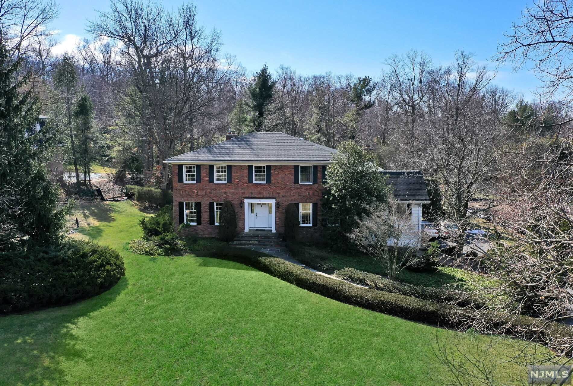 Perched in a prime location on one of Alpine's coveted cul de sacs, this timeless Georgian Colonial boasts over 4,200 sq.ft. of spacious living. Approx. one acre picturesque property and private lush landscaped grounds. Custom built and designed by the original owner in 1973. First time offered! Rare and sought after opportunity to renovate the existing home or build new on this spectacular property and location. Add your creative personal finishes and make it your own. Updated gourmet kitchen offers a generous center island and open flow to a sun filled great room. Family room and library/office both feature gas fireplaces. First floor private guest suite. Four spacious second floor bedrooms including huge Primary Suite. Grade level multi purpose basement with a 3 car garage. Prestigious Alpine is regarded for its excellent award winning schools, close proximity to NYC (8 miles to GWB), low real estate taxes and extraordinary community offering privacy and tranquility.