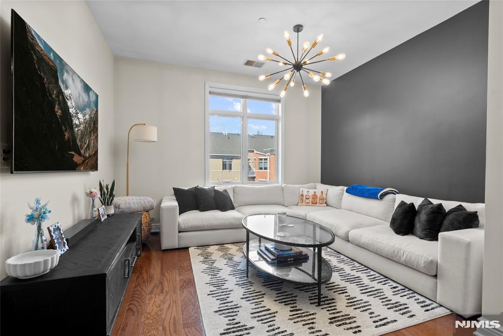 Discover this beautifully maintained, move-in ready 2-bedroom, 2-bath residence at the sought-after Hudson Pointe along the Hudson River. Spanning 1,089 sq ft, this desirable corner unit offers dual exposures, filling the home with abundant natural light throughout the day. The open-concept layout features a modern kitchen with stainless steel appliances and granite countertops, seamlessly flowing into a spacious living and dining area, perfect for both everyday living and entertaining. The primary suite includes a walk-in closet and a private en-suite bathroom, while the generously sized second bedroom offers ample closet space and flexibility for guests, a home office, or additional living needs. This home has also been updated with a new AC/furnace system and water tank, offering added comfort and peace of mind for the next owner. Residents enjoy a full suite of amenities, including a 24-hour doorman, fitness center, outdoor pool, business center, and cinema room. The cinema room, community room, conference room, and lobby have all been recently and fully renovated, enhancing the buildingâ€™s upscale appeal. This home also includes two garage parking spaces (one assigned and one floating) and offers convenient access to NYC, making it an ideal blend of comfort, style, and location.
