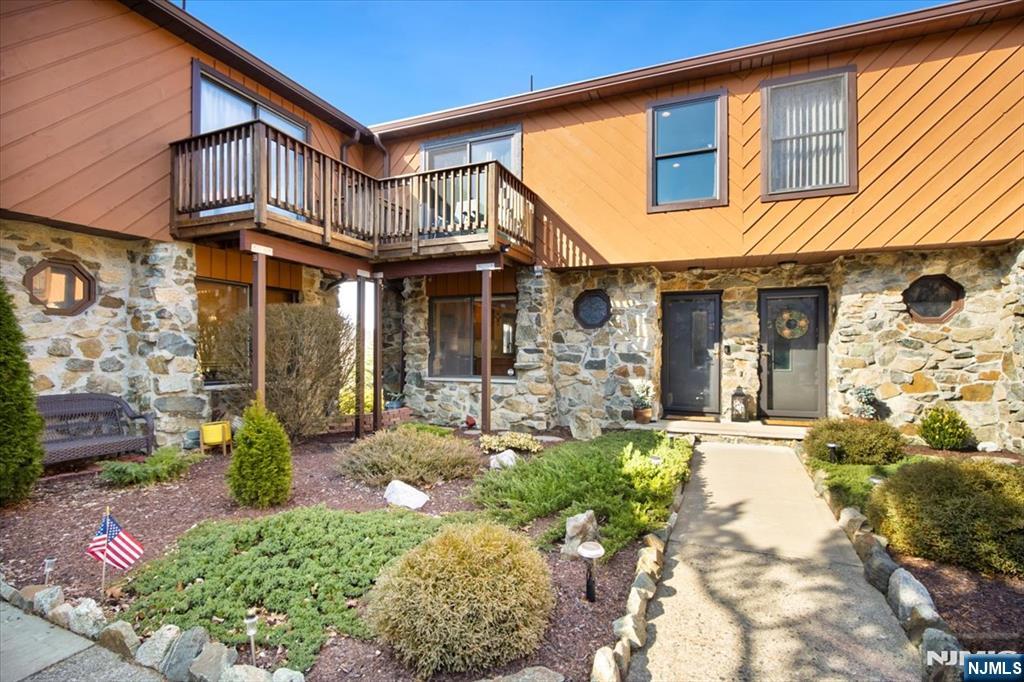 Breathtaking Mountain Views & Stylish Upgrades! This updated 2-bed, 2.5-bath townhouse offers unmatched 180-degree Ramapo Mountain views! Renovated in 2018, it features granite countertops, double crown molding, and a hand-stacked stone woodburning fireplace. The open floor plan flows to multiple decks off the living room and both bedrooms. The primary suite boasts double closets, a private bath, and deck access. The second bedroom offers a private deck. A finished basement adds extra living space, laundry, and storage with walk-out access. Unlike most, this home includes a fully floored attic for max storage! Enjoy resort-style amenitiesâ€”pool & clubhouseâ€”minutes from shopping, dining & highways. Don't miss this rare opportunity!