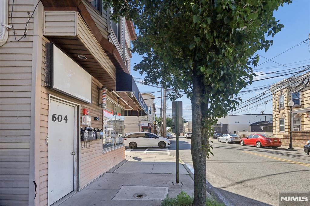 Excellent opportunity to acquire a fully leased mixed-use building in a prime location. This income-producing property features a well-established barbershop occupying the ground-floor retail space, along with three fully leased residential apartments on the upper levels, providing stable and diversified cash flow. The property also includes four dedicated parking spaces accessible via easement, a valuable amenity for both commercial and residential tenants. Located within the desirable B-C zoning district, the property offers strong long-term investment potential and flexibility. Conveniently situated near major transportation routes, shopping, dining, and neighborhood amenities, this turnkey investment is ideal for investors seeking immediate income with minimal vacancy risk. Don't miss the chance to add this well-maintained, income-generating property to your portfolio.