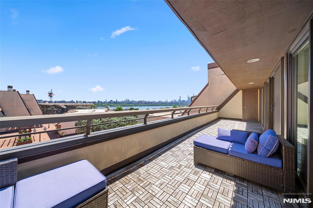 (Contact YULIYA SHINKORENKO at 2 0 1 - 3 4 1 - 7 7 7 7) - THE CLIFFHOUSE - Perched at the top of community, PENTHOUSE 62 is a spacious one-level home that spans approximately 2100-SF (including terrace & garage). It offers two bedrooms plus a versatile bonus room that can be used as a full sized office or guest room. The owner has invested significantly in replacing all the windows to enhance energy efficiency and to take advantage of the beautiful southeast views of the Hudson River and Manhattan. Gracious room sizes, private bedroom and work areas, an exceptional 33-foot river-facing terrace, fireplace, central HVAC, and a private 2-car garage complete this compelling offering. Ideally located with a NJ Transit stop directly in front of the complex, The CLIFFHOUSE has a 24-hour attended gatehouse, resident gym with sauna, and the most beautiful clifftop pool reserved for its fortunate residents. Welcome Home - (Presented by THE CHEN AGENCY, 2 0 1 - 3 4 6 - 8 8 8 8, Y u l i y a @ C h e n A g e n c y . c o m)
