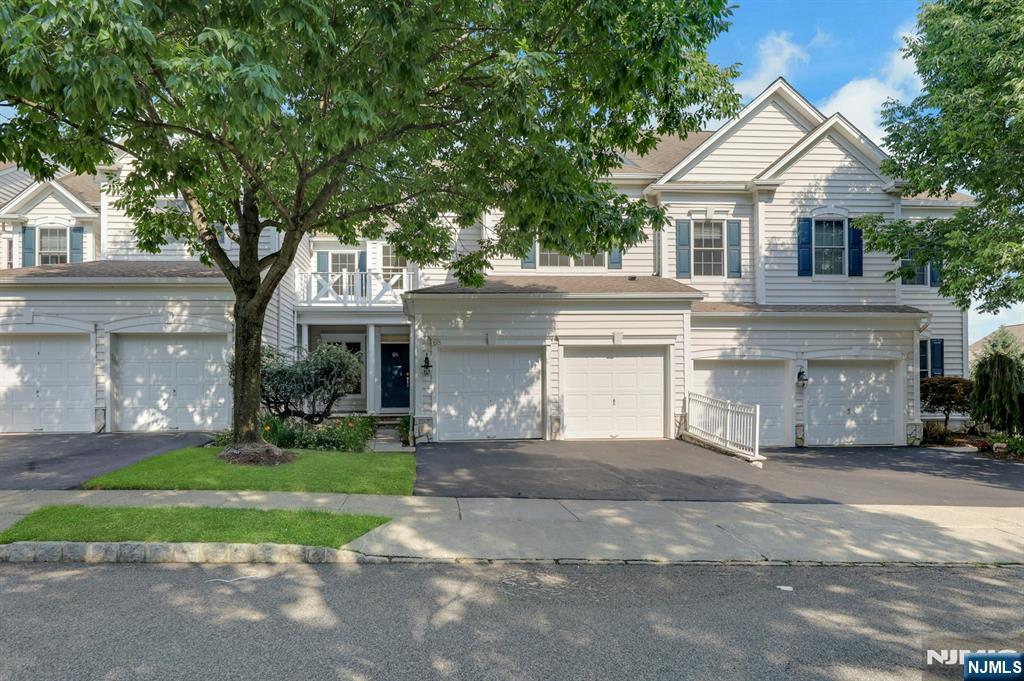 A touch of class! This exquisite Huntley model offers approximately 2,450 sq. ft. on the first and second levels, plus a finished walkout basement with approximately 1,200 sq. ft. of additional living space. Featuring 3 bedrooms, 3.5 bathrooms, and high-end upgrades throughout, this exceptional home is filled with natural light. New oak hardwood flooring spans the first and second levels. The gourmet eat-in kitchen boasts stainless steel appliances, granite countertops, a center island, and access to an expanded private terrace with a piped gas line for grilling. The spacious primary suite features a sitting area, walk-in closet, and a luxurious en-suite bath with a Jacuzzi-style soaking tub and separate stall shower. The finished walkout basement offers a media room, recreation room, office, full bath, storage area, and access to a beautifully paved patio. Additional updates include fresh interior paint, newer heating and central air systems, and a newer water heater. Located in the highly desirable gated Hickory Hill community with 24-hour security, clubhouse with kitchen and fitness center, and a heated outdoor pool. Just steps from the NYC bus stop for an easy Manhattan commute and conveniently located near major highways and a public golf course. Don't miss this opportunity to own this magnificent home!