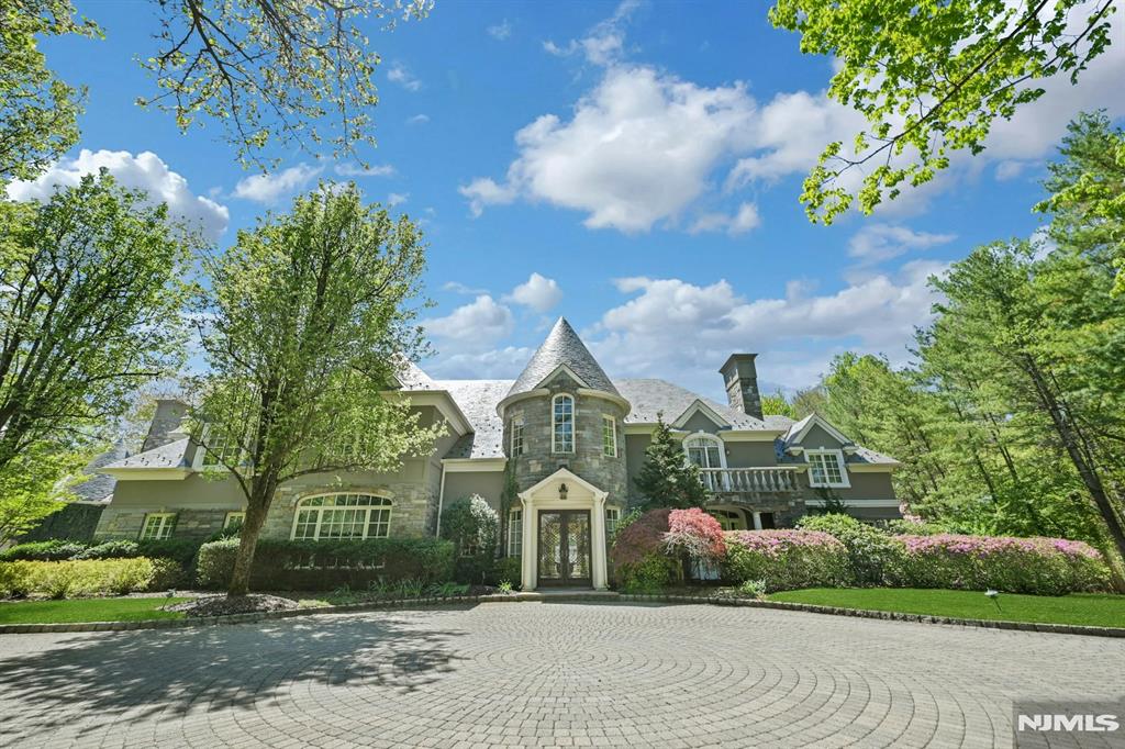 Beautifully designed French Manor Estate by well known Builder Nigro in one of the most elite communities in Saddle River. This Grand Custom built French Manor showcases European elegance and high end finishes. The Grand two story Entry Foyer has a soaring ceiling and sweeping Bridal Staircase, to your left is the Formal DR w/ a massive window that overlooks the beautiful front grounds and an adjoining Butler's Pantry. The Formal Living Room has a wood burning Fireplace and French doors to a stone balcony, luxurious Powder Rm, wood paneled Office/Library elegantly appointed with built ins and Fireplace, All Seasons Rm drenched in natural sunlight, long hallways, Chef's Kitchen with Lg Island, Breakfast Area and Walk in Pantry, 2nd PR, Great Rm w/Vaulted Ceiling, Bar, Fireplace and French doors to the back Stone Balcony. Second floor offers Master BR with Fireplace, 3 Walk in closets and French doors to a Balcony, Master BA w/jacuzzi tub, 5 Bedrooms all with En-suite Bathrooms for maximum comfort and privacy, Lg Laundry Rm and a back Staircase. Elevator goes to all 3 floors, partially finished basement with Entertainment area, HBA and work area. Lg unfinished area for storage. The resort like backyard offers mature landscaping, a stone balcony the length of the home, a heated Gunite Pool w/spa and a Newly renovated Pool House w/Eat in Kitchen, Family Area w/Vaulted Ceiling, BR, FBA, Elevator and a lower level that has a laundry room, Exercise Rm, BR, and FBA. A must see home!
