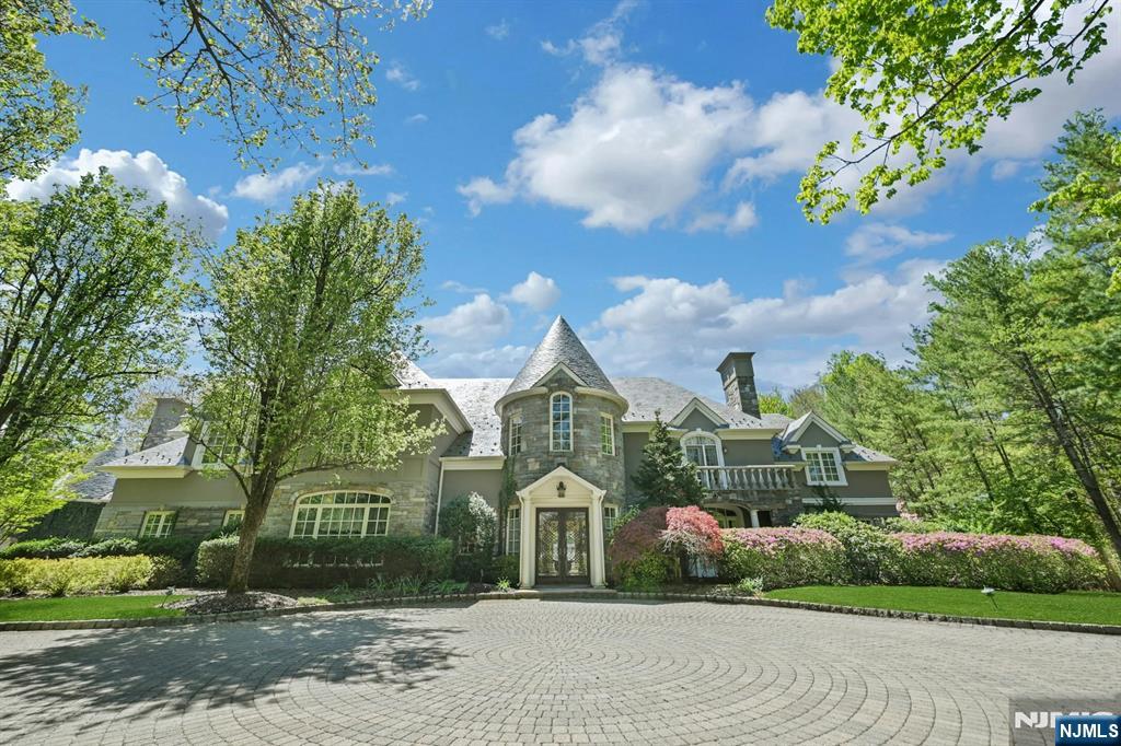 Beautifully designed French Manor Estate by well known Builder Nigro in one of the most elite communities in Saddle River. This Grand Custom built French Manor showcases European elegance and high end finishes. The Grand two story Entry Foyer has a soaring ceiling and sweeping Bridal Staircase, to your left is the Formal DR w/ a massive window that overlooks the beautiful front grounds and an adjoining Butler's Pantry. The Formal Living Room has a wood burning Fireplace and French doors to a stone balcony, luxurious Powder Rm, wood paneled Office/Library elegantly appointed with built ins and Fireplace, All Seasons Rm drenched in natural sunlight, long hallways, Chef's Kitchen with Lg Island, Breakfast Area and Walk in Pantry, 2nd PR, Great Rm w/Vaulted Ceiling, Bar, Fireplace and French doors to the back Stone Balcony. Second floor offers Master BR with Fireplace, 3 Walk in closets and French doors to a Balcony, Master BA w/jacuzzi tub, 5 Bedrooms all with En-suite Bathrooms for maximum comfort and privacy, Lg Laundry Rm and a back Staircase. Elevator goes to all 3 floors, partially finished basement with Entertainment area, HBA and work area. Lg unfinished area for storage. The resort like backyard offers mature landscaping, a stone balcony the length of the home, a heated Gunite Pool w/spa and a Newly renovated Pool House w/Eat in Kitchen, Family Area w/Vaulted Ceiling, BR, FBA, Elevator and a lower level that has a laundry room, Exercise Rm, BR, and FBA. A must see home!