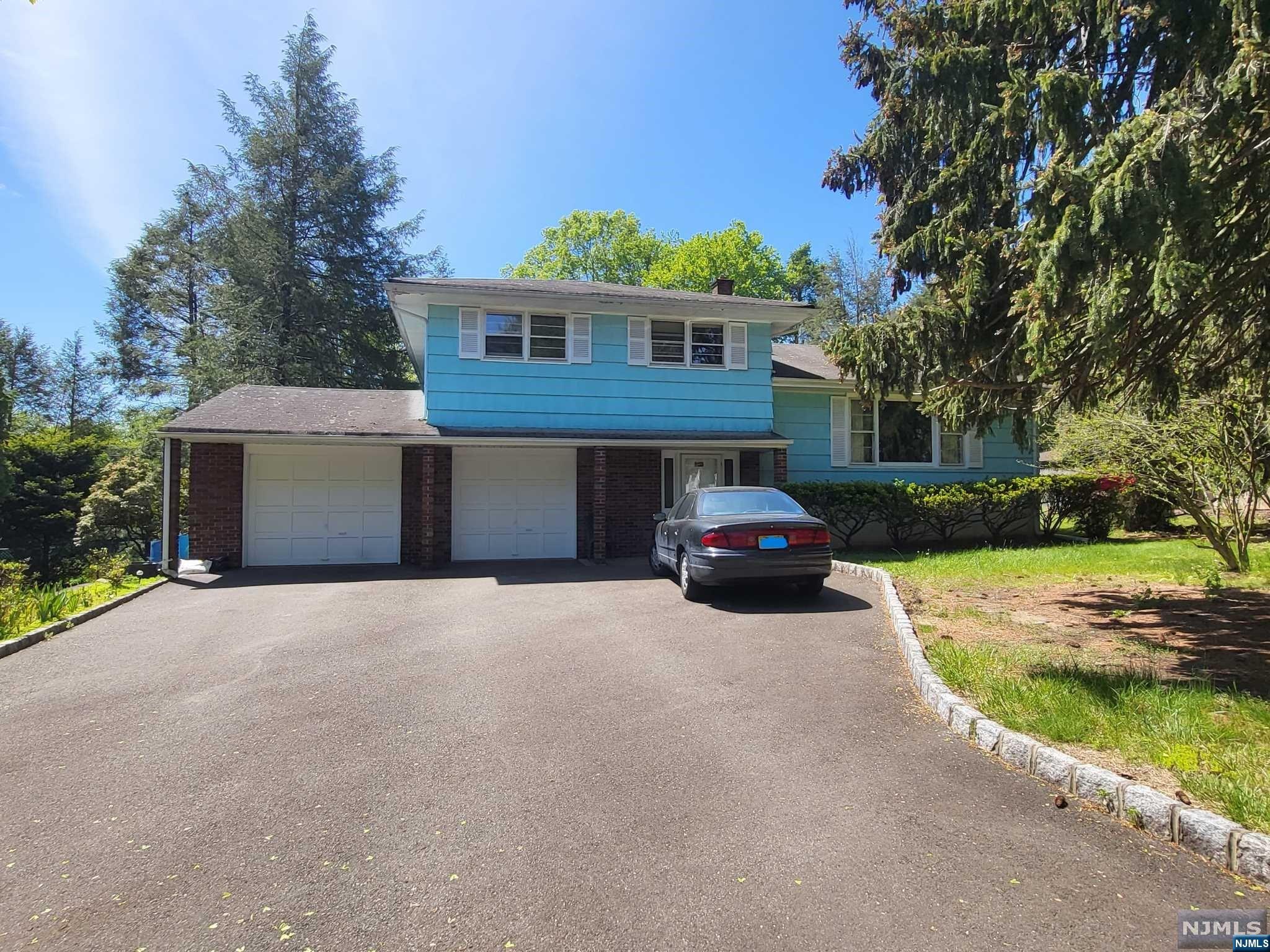 What an opportunity! Located in West side of town, close to everything! Almost half-acre Level Property. Over 2000sf of living space, waiting for your updates! Spacious rooms and fantastic layout. Lg Family Rm with walk-out to HUGE backyard! SO much space to add on or put in a pool! Main Level is large living room, dining room and kitchen, with additional access to lower level Family Room. Upstairs are 3 large bedrooms, wood floors under carpet. Lg Bathroom with access from Primary BR too. Basement level is partially finished as office and storage areas. Excellent potential all around, million+ dollar homes across the street! Ideal for commuters.