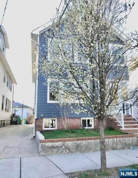 Amazing 3 Story Multi family Home on Approx 4791 ft. Boasts 2018 Newer Vinyl siding & Electric System Installed in Home, Newer Gutters/Liters, 2018 Roof, Updates to plumbing throughout. 1ST floor features: 2 Brms, 2018 Eat in Kitchen W/ Appliances. LivRm/DinRM with 2024 New Floors (luxury Vinyl). 2024 Freshly Painted. Newer Full Bath. Walkout to Deep yard from Kitchen. The 2nd floor Features: 3 BedRms & 2 Rooms on 3rd level (Gutted & Renovated in 2018). Newer Eat in Kitchen W/ appliances, sheetrock & Newer floor(Tiled). LivRm (Nice size).Full bath 2018 Renovated with sheetrock, toilet, bath, sink & Vanity. 2018 Front & Back doors installed. Home has separate entrances for Both Units. Big (Sold as is- Un fin Bsmnt that can be easily finished W/Toilet-).(Newer windows).Deep large yard that is Partially fenced in. 2018 Patio. Driveway for up to 3 cars. Conveniently located near schools, transportation, restaurants, worship,Highways 3,17,21 NJ TurnPike & train.Home is Sold as is.