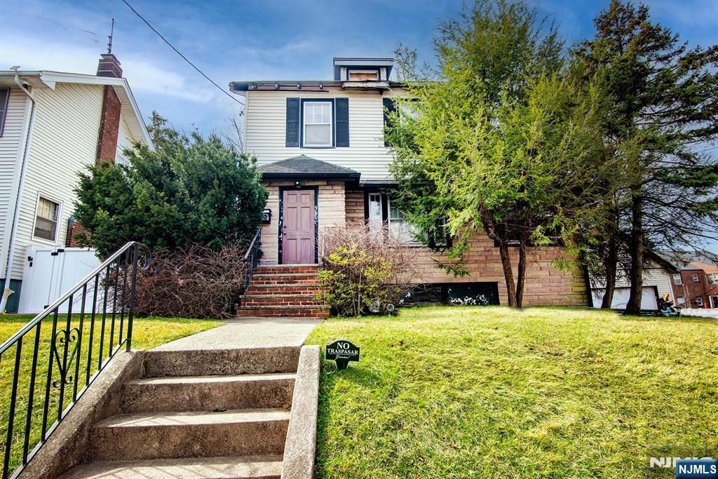 This 3 bedroom 1.5 bathroom Colonial house has been gutted and is ready for renovation. A great opportunity for investors, contractors, or buyers looking to customize their dream home. Property requires new kitchen, boiler, water heater, bathrooms, roof, some windows. Detached two-car garage is in need of repair. Convenient commuter location near express bus service to NYC. Sold strictly as-is.