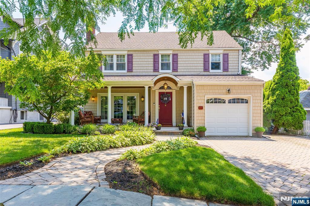 Welcome to 221 West Passaic Avenue in the beautiful town of Rutherford. This beautifully maintained colonial sits on a 50 x 160 property and is in absolutely move-in condition. The home offers a beautiful front porch with mahogany flooring, entry hall closet, living room with a woodburning fireplace, separate dining room, an office/den area plus a fabulous kitchen with center island, half bath, laundry and entry to the one car attached garage. The second floor offers a primary bedroom and bath, 2 other good size bedrooms and another full bath. There is a pull down stairs to attic with fan which offers excellent storage. The basement is partially finished and has extra storage space. The yard is a fabulous summer oasis, including a gorgeous in-ground heated 17 x 32 inground pool, a hot tub and a huge deck accessible from the kitchen. Come by and visit this little piece of paradise - you will not be disappointed!