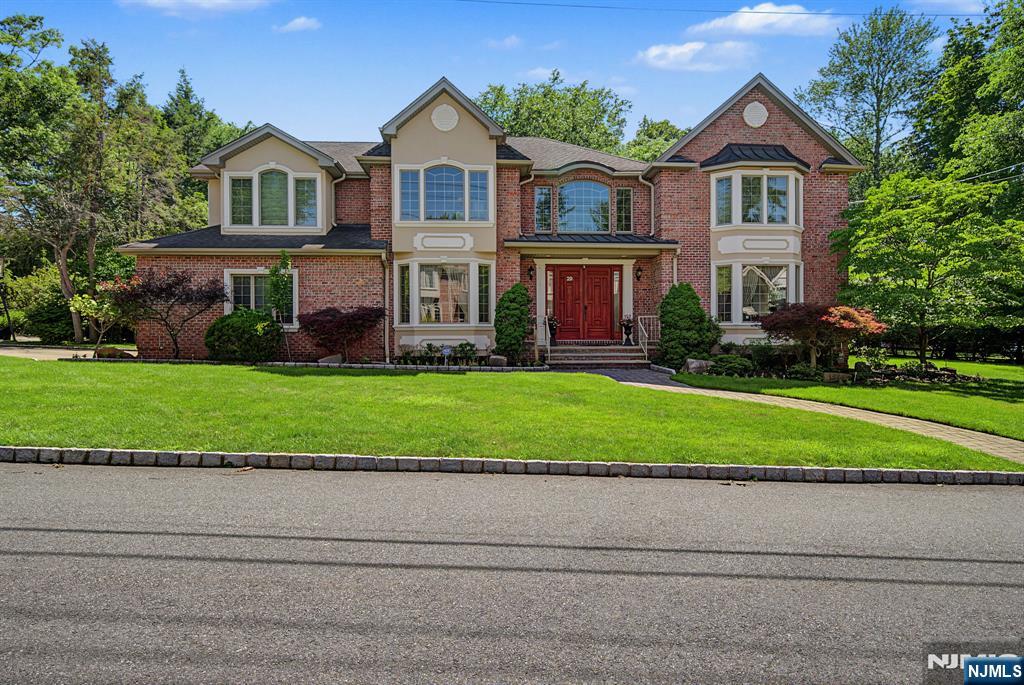 Elegant and Timeless Brick Center Hall Colonial situated in the East Hill section of Demarest. Main level highlights 2-story Entry Foyer, gracious Formal Living Room, elegant Formal Dining Room, bright Great Room w/fpl which flows seamlessly into the MEIK w/center island, Powder Room, Laundry Room, Bedroom w/Full Bath, 2-car Garage. Second floor features Primary Suite w/ Spa-Like Primary Bath, 2 generously sized Bedrooms, 1 Bedroom w/ its own En-Suite Bath, and additional Full Bathroom. Basement is fully finished for Recreation and Relaxation offers expansive Entertainment Area, Workout Space, and Movie Theater for hosting Family and Friends. Demarest is one of Bergen County's most desirable communities, this exceptional home offers a combination of elegance, comfort, and convenience. Enjoy top-rated Schools and all the perks of living in a wonderful Town. Truly a special place to call Home.