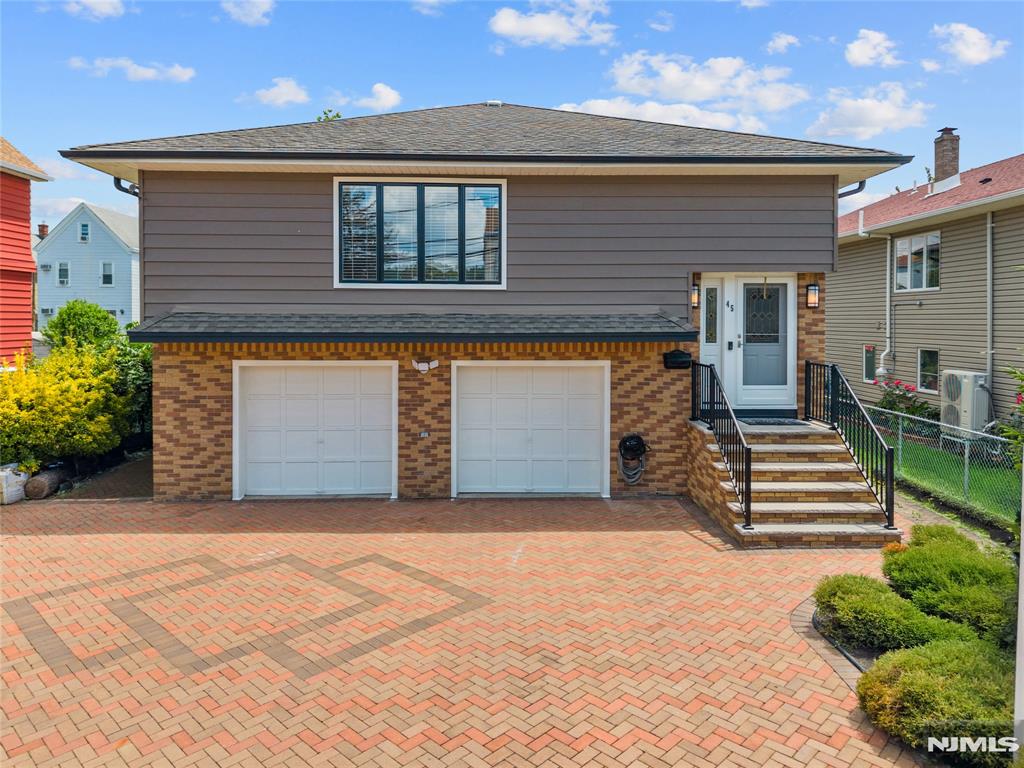 Welcome to this stunning fully renovated home located in the heart of the highly sought-after Athenia section just minutes from the train station, major highways, shopping, and dining. Completely reimagined with modern elegance and exceptional attention to detail, this move-in-ready home offers the perfect blend of style, space, and versatility.Step inside to discover bright, open-concept living spaces filled with natural light, beautifully updated kitchens and bathrooms, gleaming floors, and designer finishes throughout. Thoughtfully designed for flexible living, the home features a spacious in-law suite complete with a second kitchenette, offering both comfort and privacy while maintaining a warm and inviting atmosphere.Generously sized bedrooms, ample storage, and a beautifully maintained exterior make this property truly stand out. Whether you're looking for additional living space, guest accommodations, or simply a beautifully renovated home in a prime commuter location, this exceptional property checks every box.A rare opportunity to own a turnkey home in one of the area's most convenient and desirable neighborhoods!