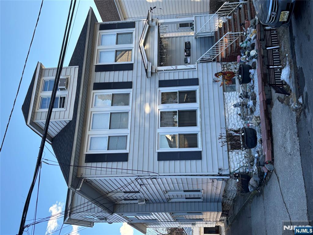Don't miss this fantastic investment opportunity in the desirable West Side/Hillcrest section of Paterson! This well-maintained 3-family home offers a spacious layout and great income potential. First & Second Floor Units: Each features 3 bedrooms, a living room & dining room combo, an enclosed front porch, and ample living space or a bonus bedroom. Third Floor Unit: A cozy 1-bedroom apartment with a living room, eat-in kitchen, and full bath perfect for added rental income or an owner-occupant. Finished Basement: Additional living space with endless possibilities for storage, recreation, or expansion. Outdoor & Parking: Private backyard and a detached garage for off-street parking. This home is close to schools, parks, public transportation, and major highways. Whether you're an investor or looking for a multi-family home to live in, this property offers spacious living, great location, and strong potential. Property is Being Sold As Is