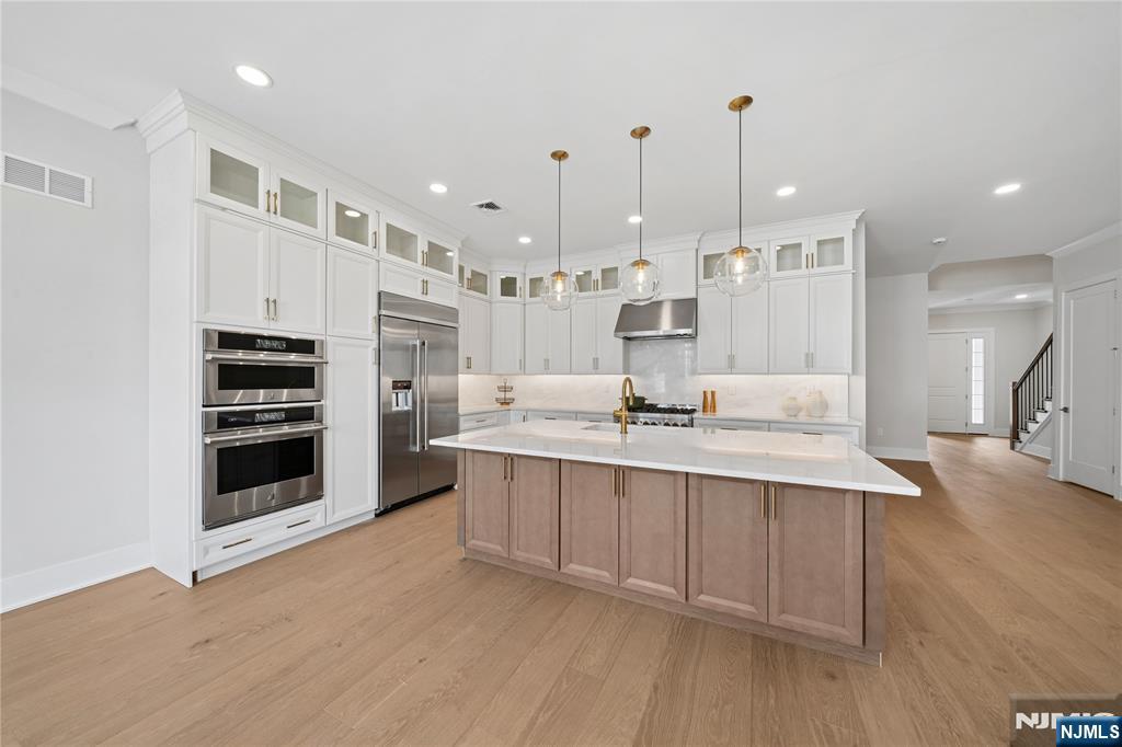 FINAL3 HOME SITES AVAILABLE! The Elgin's welcoming covered porch and stunning two-story foyer reveal the spacious great room and casual dining area, with views to the desirable large patio beyond. The well-equipped gourmet kitchen is highlighted by a large center island with breakfast bar, plenty of counter and cabinet space, and roomy walk-in pantry. This home's kitchen offers features others dream of including Quartzite countertops and slab backsplash, stacked cabinetry highlighting the 10' ceiling height, double ovens, a built-in refrigerator (to be installed), and an expanded island. The elegant primary bedroom suite is enhanced by dual walk-in closets and deluxe primary bath with dual-sink vanity, large soaking tub, luxe shower with seat, linen storage, and private water closet. Central to a generous loft, secondary bedrooms feature walk-in closets and shared hall bath. The finished basement includes a full bathroom and plenty of storage space. Enjoy sunset BBQs on your west-facing patio with gas line for a grill.