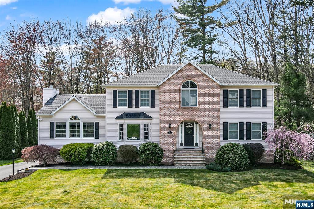 Stunning Colonial In Old Milford Estates Over 3,500 SqFt. Of Elegant Living! Come See This Beautiful Home Showcasing True Pride Of Ownership Throughout! Step Into A Foyer Flanked By A Formal Living Room And Dining Room, Setting The Tone For The Elegance Within. The Main Level Features A Convenient First-Floor Bedroom, Laundry Room And Powder Room. At The Heart Of The Home Is A Spacious Great Room With A Floor-To-Ceiling Stone Wood Burning Fireplace And Oversized Windows That Warms With Natural Light. The Bright Eat-In Kitchen Provides A Center Island, Breakfast Bar, And Sliding Glass Doors That Opens To A Full-Length Expansive Deck Ideal For Entertaining, While Overlooking The Professionally Landscaped Lawn. Upstairs, You'll Find 4 Additional Bedrooms. The Lavish Primary Suite Has A Cathedral Ceiling, A Deep Walk-In Closet, And A Luxurious En-Suite Bath Complete With A Jetted Soaking Tub, And A Stall Shower. The Fully Finished Lower Level With Garage Access, Offers Flexible Space For A Recreation Area, Media Room, Gym, Or Home Office. It Also Includes A Large Utility And Storage Room With Walk-Out Access To The Backyard. Additional Features & Updates: 2.5 Bathrooms, Natural Gas & Underground Utilities, Public Water & Sewer, Newer Hot Water Heater 2020, Roof In 2019, Furnace 2015, Ample Storage Throughout, Exceptional Flexibility For Any Lifestyle. This Home Blends Grandeur With Everyday Comfort An Absolute Must-See!