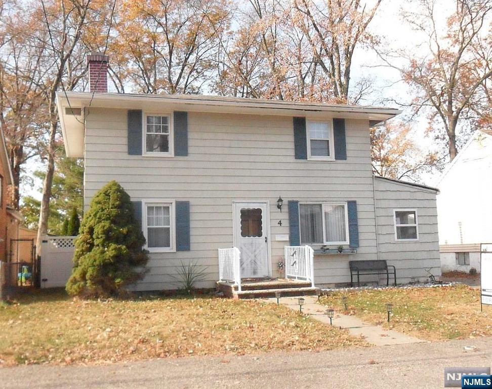 This Colonial gem in Wanaque features 3 bedrooms and a full bath on the main floor. Step into a welcoming living and dining area, warmed by a stone-accented fireplace and bathed in natural light. The spacious kitchen provides stainless steel appliances, plenty of cabinetry, and room for an eat-in setup, with a mudroom just beyond for added storage. Upstairs, you will find three bedrooms, plus a handy utility room. Outside, a large, level, fully-fenced backyard with a deck and a roomy storage shed offers privacy and a perfect setting for outdoor gatherings. A single-width driveway and proximity to NYC transit, schools, and shopping complete this convenient, charming home.