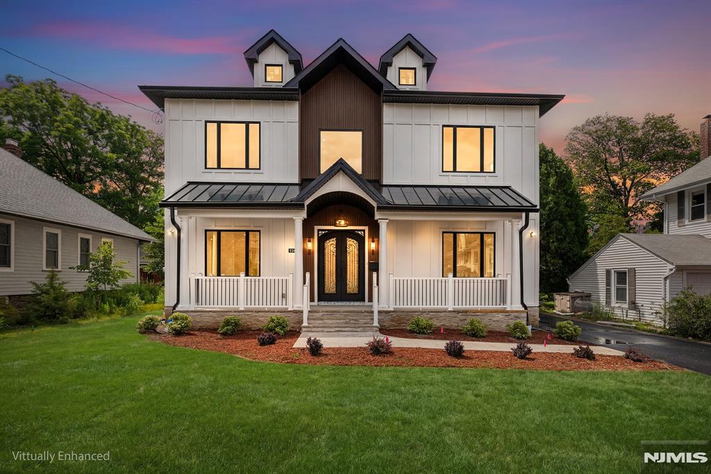 Spectacular custom-built new construction home offering over 4,500 square feet of luxurious living space in one of Glen Rock's most desirable locations. Just moments from downtown, shopping, dining, and NYC-bound train service. A grand two-story foyer with a sweeping curved staircase creates an impressive first impression. The main level features 10-foot ceilings, hardwood flooring, custom millwork, a formal living room, an elegant dining room with a butler's pantry, and a sun-filled family room. The gourmet chef's kitchen is appointed with quartz countertops, premium Thermador appliances, custom cabinetry, and an oversized center island. A first-floor bedroom, full bath, and powder room provide flexibility for guests or extended living arrangements. The second floor continues with 10-foot ceilings throughout and features a luxurious primary suite complete with a private balcony, fireplace, spa-inspired bath, and spacious walk-in closets. A junior en-suite bedroom and two additional bedrooms connected by a Jack-and-Jill bath complete this level. The fully finished lower level offers exceptional additional living space, including a home theater, expansive recreation room, bedroom, full bath, and abundant storage. Designed for year-round enjoyment, the outdoor living area features a spacious deck, expansive patio and built-in outdoor kitchen. A detached two-car garage completes this extraordinary offering.