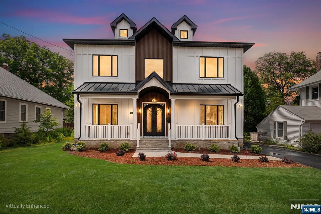 Spectacular custom-built new construction home offering over 4,500 square feet of luxurious living space in one of Glen Rock's most desirable locations. Just moments from downtown, shopping, dining, and NYC-bound train service. A grand two-story foyer with a sweeping curved staircase creates an impressive first impression. The main level features 10-foot ceilings, hardwood flooring, custom millwork, a formal living room, an elegant dining room with a butler's pantry, and a sun-filled family room. The gourmet chef's kitchen is appointed with quartz countertops, premium Thermador appliances, custom cabinetry, and an oversized center island. A first-floor bedroom, full bath, and powder room provide flexibility for guests or extended living arrangements. The second floor continues with 10-foot ceilings throughout and features a luxurious primary suite complete with a private balcony, fireplace, spa-inspired bath, and spacious walk-in closets. A junior en-suite bedroom and two additional bedrooms connected by a Jack-and-Jill bath complete this level. The fully finished lower level offers exceptional additional living space, including a home theater, expansive recreation room, bedroom, full bath, and abundant storage. Designed for year-round enjoyment, the outdoor living area features a spacious deck, expansive patio and built-in outdoor kitchen. A detached two-car garage completes this extraordinary offering.