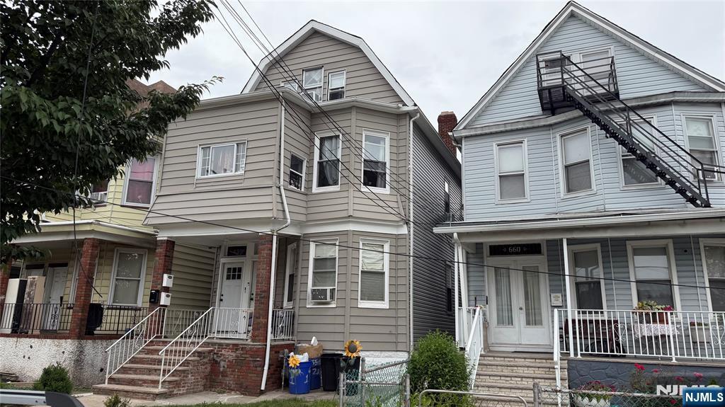 Exceptional two-family home in North Elizabeth offering the perfect blend of owner-occupancy and investment potential! Conveniently located just minutes from Newark Liberty International Airport, Route 1 & 9, shopping, dining, and public transportation, this versatile property is ideal for both homeowners and savvy investors. The first-floor unit has been beautifully renovated and features 2 bedrooms, 1 full bath, new flooring, fresh paint, recessed lighting, an updated bathroom, and a modern kitchen, creating a move-in-ready space. The second unit spans the second and third floors, offering an impressive 5 bedrooms and 3 full baths with a spacious layout that's perfect for a large household or maximizing rental income. Additional highlights include separate utilities, an unfinished basement with endless possibilities for storage, recreation, or future finishing, and a fenced backyard ideal for entertaining, pets, or outdoor enjoyment. Whether you're looking to live in one unit while offsetting your mortgage with rental income or add a strong cash-flowing asset to your investment portfolio, this property checks all the boxes. A rare opportunity to own a spacious, income-producing multi-family in one of Elizabeth's most convenient locations - don't miss this one!!